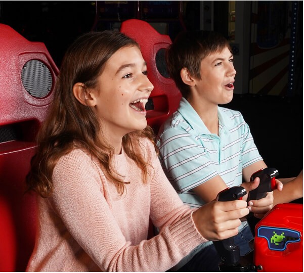Two-Kids Enjoy Playing Shooting Games Arcade